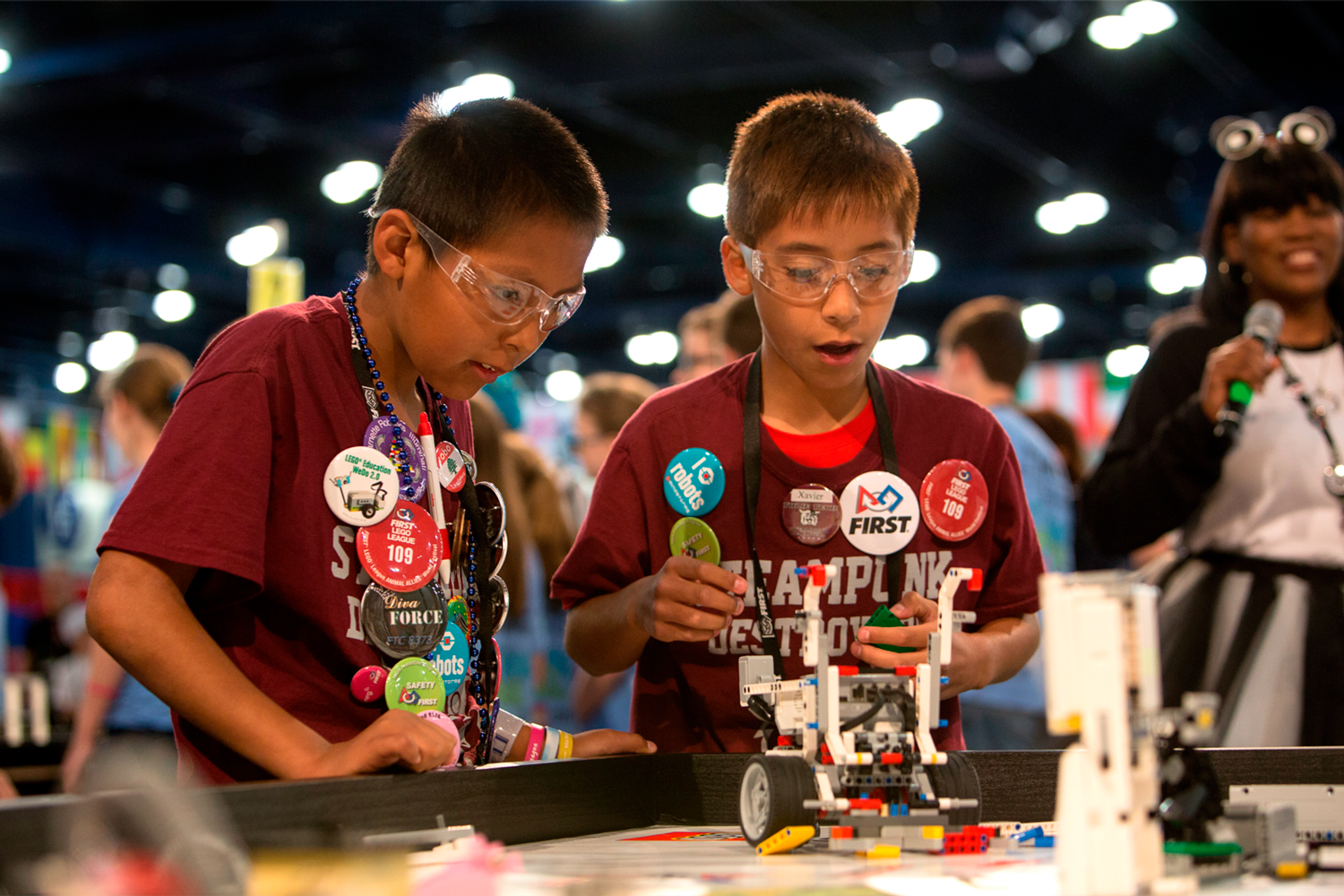Students building a LEGO robot at FIRST LEGO League